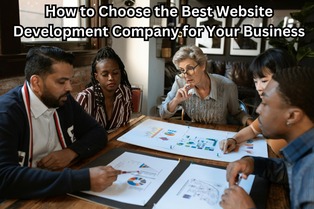 Four people collaborating on web development in a company